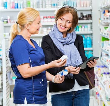 female pharmacist introducing medicine to customer