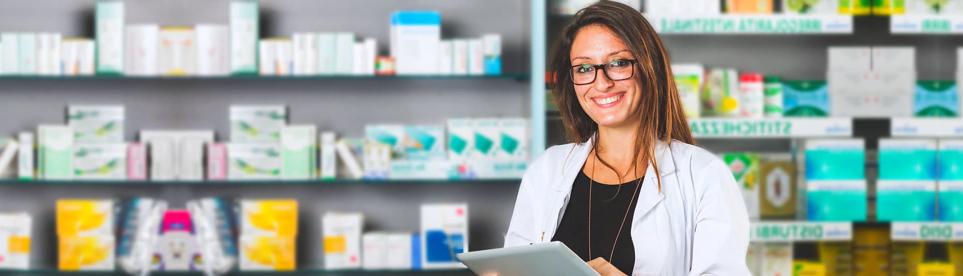 female pharmacist wearing eyeglasses smiling