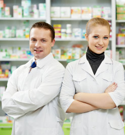 cheerful pharmacist chemist women standing in pharmacy drugstore